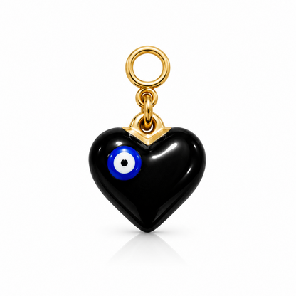A black heart-shaped charm with a blue and white evil eye detail and a gold-tone loop at the top, shown on a clean white background.