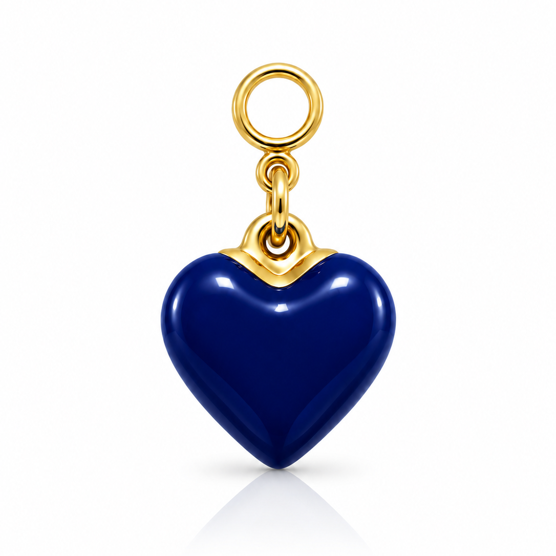 A heart-shaped pendant charm with a glossy deep blue enamel body and polished gold-tone metal loops and trim, shown on a clean white background with a soft reflection below.
