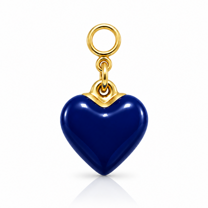 A heart-shaped pendant charm with a glossy deep blue enamel body and polished gold-tone metal loops and trim, shown on a clean white background with a soft reflection below.