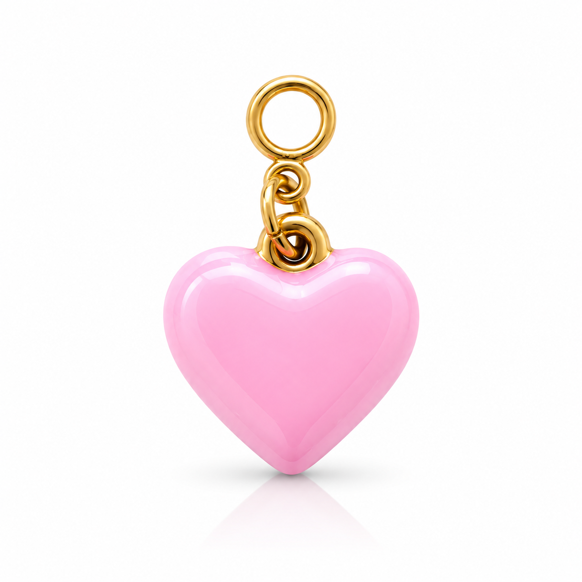 A glossy pink heart-shaped charm with a gold-tone metal loop and chain, shown on a clean white background with a soft reflection below.