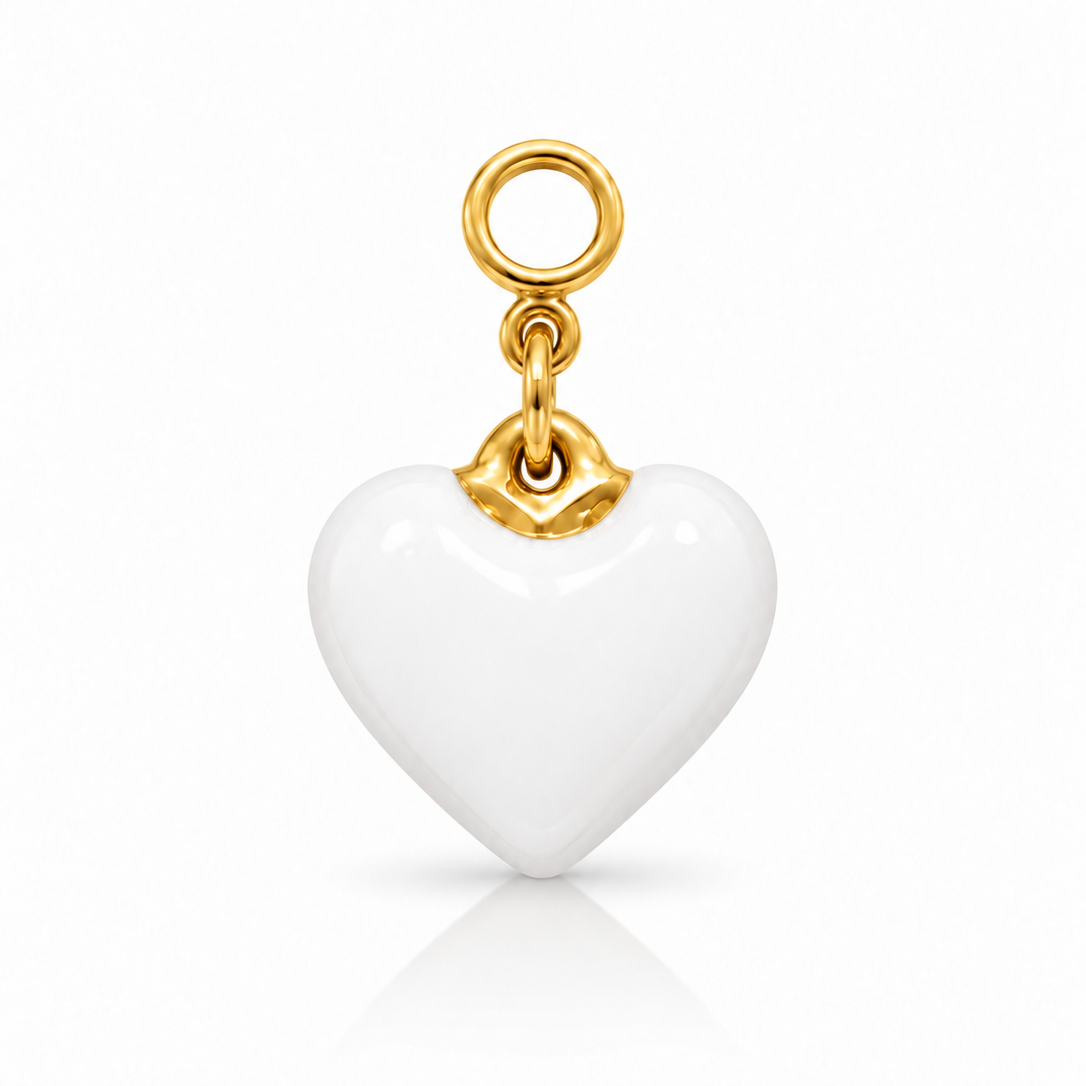 A white heart-shaped charm pendant with a polished gold top loop and connector, shown on a clean white background with a soft reflection below.