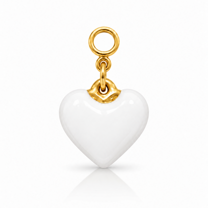 A white heart-shaped charm pendant with a polished gold top loop and connector, shown on a clean white background with a soft reflection below.