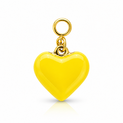 A bright yellow heart-shaped pendant charm with a polished gold-tone metal loop at the top, shown on a clean white background with a soft reflection underneath.